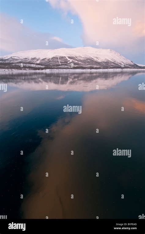 Reflection Of The Mountain Nuolja In Frozen Lake Tornetraesk Abisko