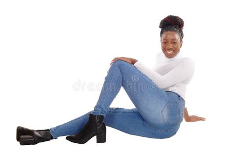 Pretty African Female Sitting On The Floor In Jeans Stock Image Image