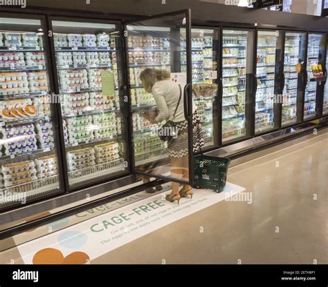 A Shopper Chooses Cafe Free Eggs In A Cooler In The New Whole Foods