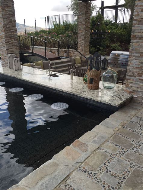 Visit us today for the widest range of outdoor living products. Sunk in BBQ pool bar stools NTS: raise the counter a little. | Pool bar, Indoor outdoor ...