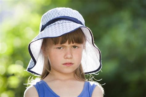 Close Up Portrait Of Serious Little Girl In A Big Hat Child Having Fun