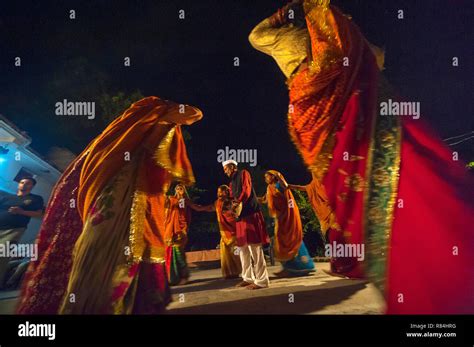 Group Of Indian Womans Wearing Colorful Saris Performing A Traditional