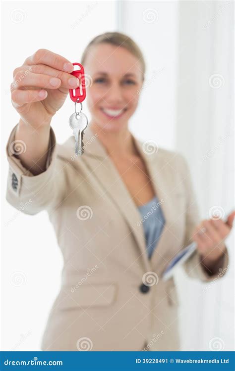 Smiling Estate Agent Showing Keys To Camera Stock Image Image Of