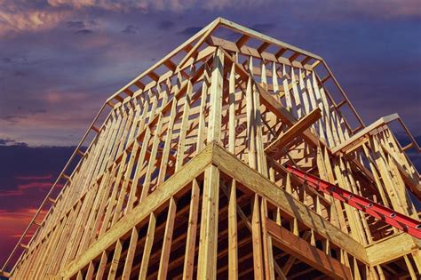 New Residential Construction House Framing Against A Sunset Stock Image
