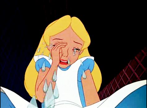 An Animated Image Of A Blonde Girl Crying In Bed With Her Hand On Her Face