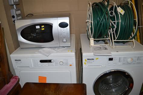 A Miele Model W3240 Automatic Washing Machine And A T8822c Matching