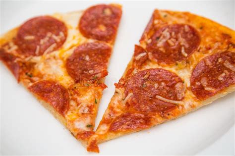 Two Slices Of Pepperoni Pizza On White Plate Stock Image Image Of