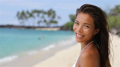 Beautiful Asian Bikini Woman Relaxing On Beach Blowing A Kiss At Camera