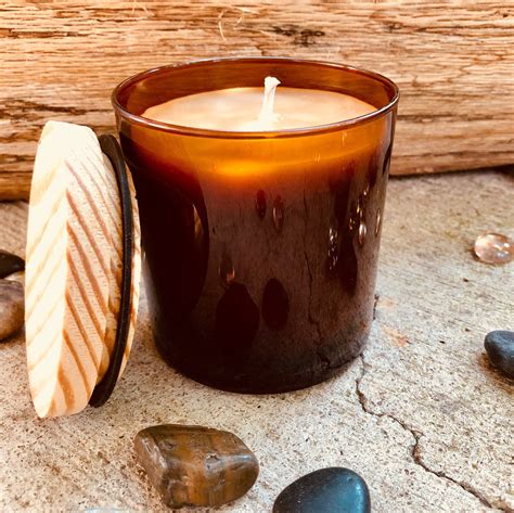 Pure Organic Beeswax Candle In An Amber Glass Jar Topped With Wooden