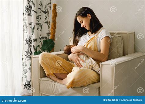 Newborn Baby Boy Sucking Milk From Mothers Breast Portrait Of Mom And