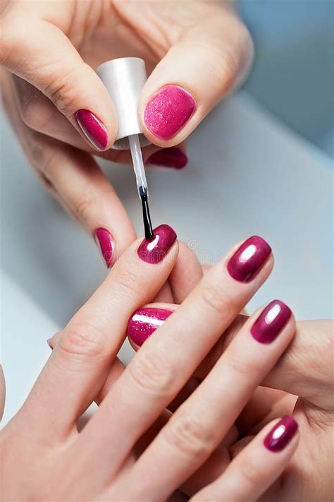 Woman Applying Nail Varnish To Finger Nails Stock Image Image Of
