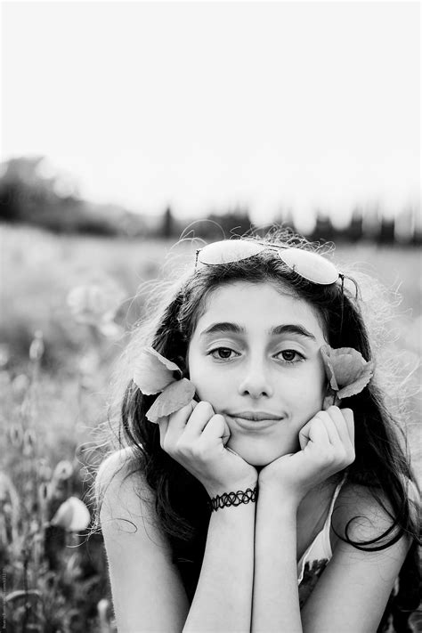 Black And White Portrait Of A Girl Looking At Camera Outdoors By Stocksy Contributor Beatrix