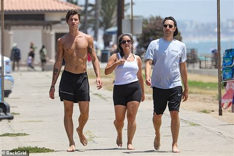 Shawn Mendes Bares His Shredded Abs As He Enjoys A Beach Day In Santa