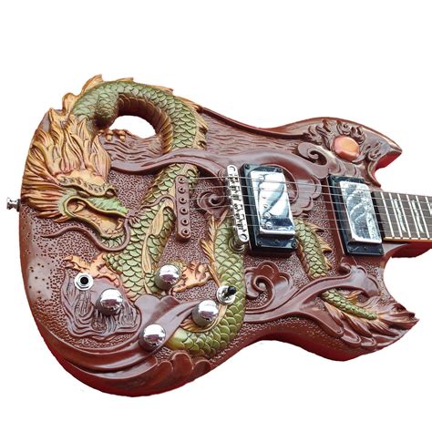 An Intricately Carved Guitar With A Dragon On It