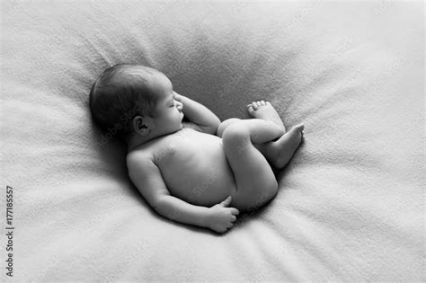 Beautiful Naked Newborn Baby Babe Sleeping Peacefully As If He Would Still Be In Womb Stock