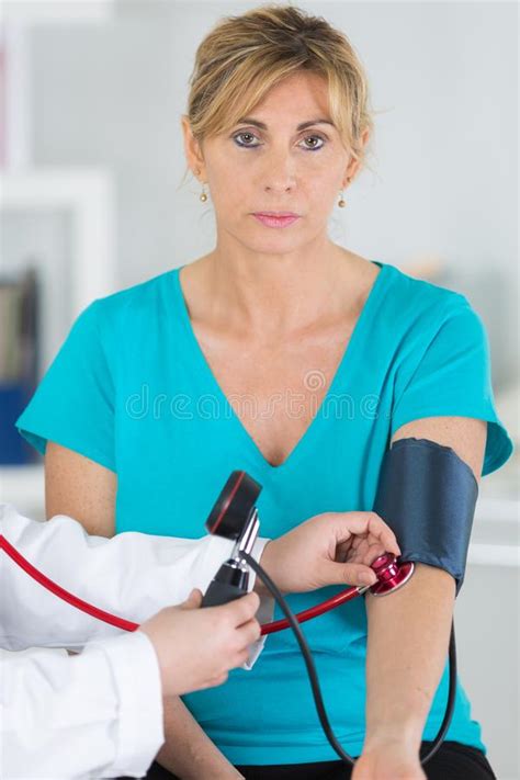 Middle Aged Lady Having Blood Pressure Test Stock Photo Image Of