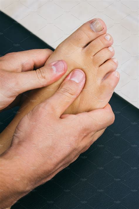 Physiotherapist Massaging A Foot High Quality Health Stock Photos