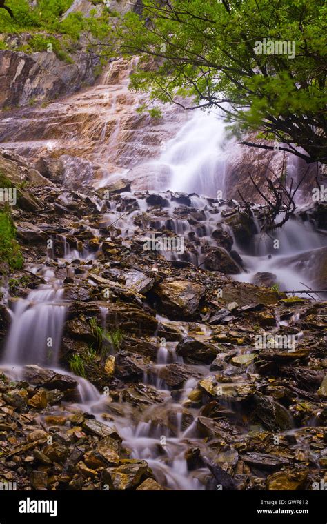 Beautiful Waterfall Flowing Among Stones Rocks And Forest In The Altai