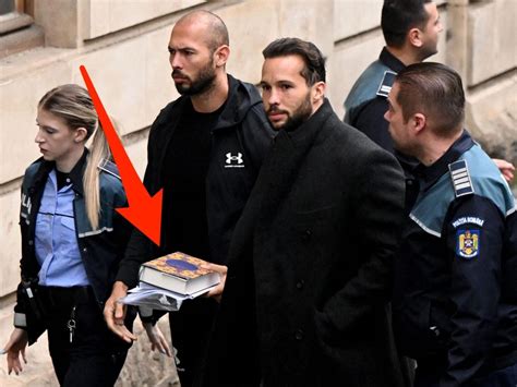 Photos Show A Handcuffed Andrew Tate Carrying The Quran To His Court Appearance On Sex
