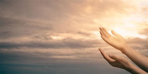 Woman Hands Praying For Blessing From God With Sunlight On Sunset