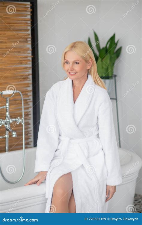 blonde pretty woman in a white bath robe in a bathroom stock image image of white room 220532129