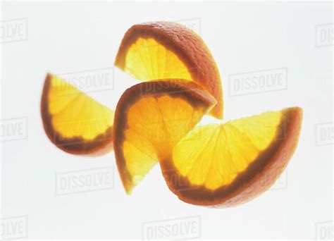 Four Orange Wedges Stock Photo Dissolve