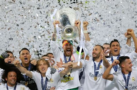 Real Madrids Sergio Ramos Celebrates With The Trophy After The