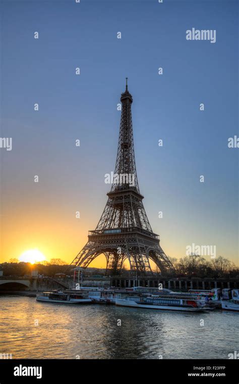 Eiffel Tower At Sunrise By The Seine River Paris France Stock Photo