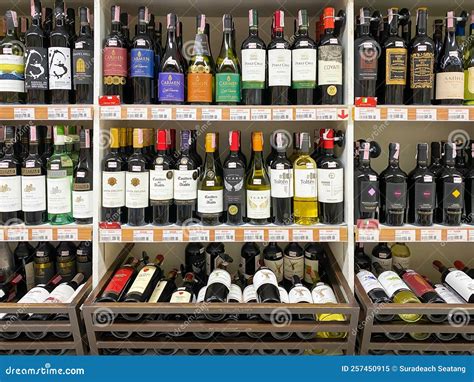 Many Bottles Of Wines On The Shelf For Sale In The Foodland Supermarket