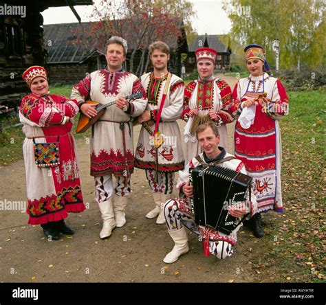 a russian folk music group in traditional clothing in a small remote amyh7m 1300×1219