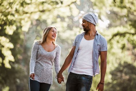 Happy Mixed Race Couple In Walking Stock Photo Image Of Affectionate