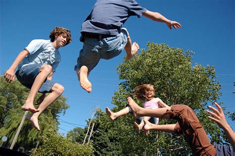 Most all gymnastic places use rectangular trampolines to their superior bounce quality and also their higher weight limit. Children Jumping On Trampoline Stock Photo - Download Image Now - iStock