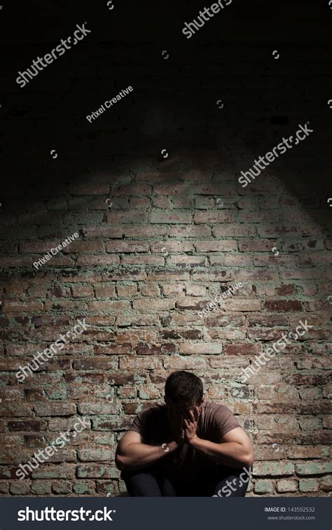 Sad Man Sitting Alone Against Brick Stock Photo 143592532