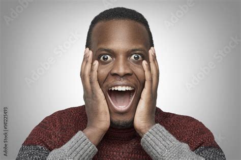 Close Up Portrait Of Excited African American Male With Shocked And