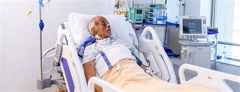 Patient In Icu Hospital Bed