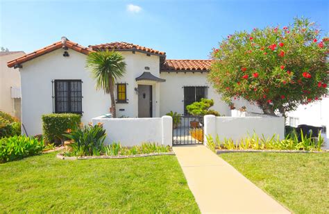 Spanish style homes are generally characterized by red tile roofs, thick stucco walls, and courtyards that function as an extension of the interiors. Front courtyard in California Spanish Bungalow home ...