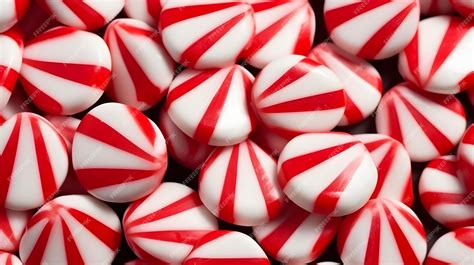 Premium Ai Image Red And White Striped Peppermint Candies Arranged