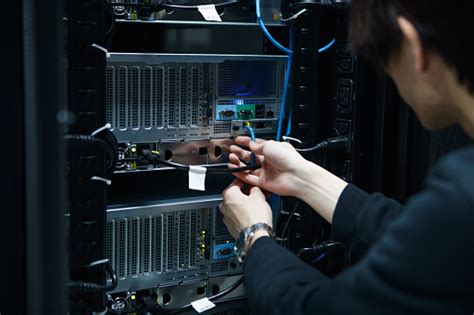 It Expert Working On Computer Server Equipment Stock Photo Download