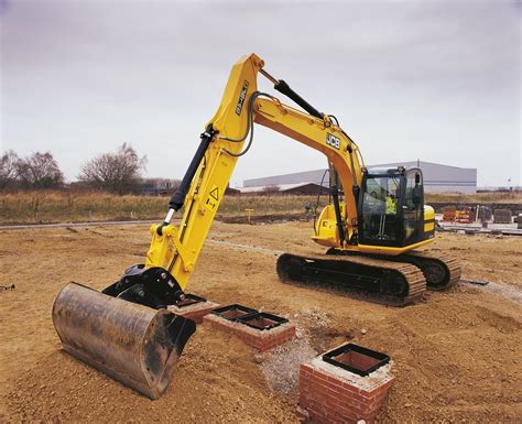 The house sits atop an undercarriage with tracks or wheels. JCB JS145 Excavator | Construction Equipment