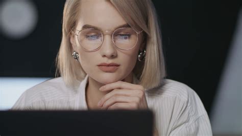 Thoughtful Business Woman Looking Laptop In Dark Office