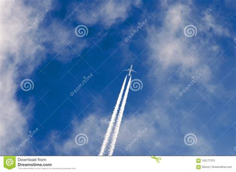 Airplane Contrail Clouds Against The Blue Sky Stock Image Image Of