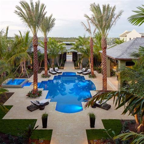 This Courtyard Pool Surrounded By Towering Palms Is An Idyllic Setting
