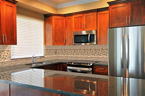 Cabinets can be all dark, or just the bottom cabinets while the top remain a lighter color, or vise versa. Uba Tuba Granite Countertops (Pictures, Cost, Pros & Cons)