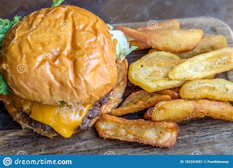 Burger And French Fries On The Wooden Table Stock Image Image Of