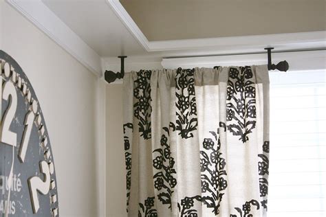 Hanging lightweight curtains the easy way. Ceiling Mount Drapery Trick | Ceiling mount curtain rods ...
