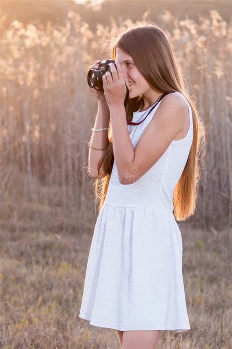 Girl Holding A Camera Taking Pictures Stock Photo Image Of Girl