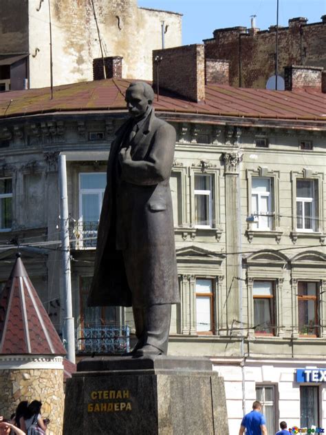 Stepan Bandera Statue Of A Man In A Town Front Of Building Middle City