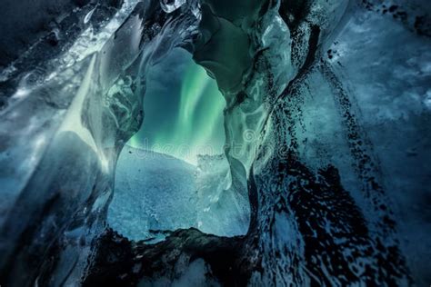 Northern Lights Aurora Borealis Over Glacier Ice Cave Stock Photo