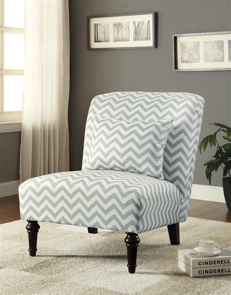 Gray and blue wingback dining chairs sit at an ebony stained dining table positioned on a diamond jute rug and flanked by black bamboo dining chairs with white cushions. White/Grey Chevron Accent Chair | Las Vegas Furniture Store | Modern Home Furniture ...