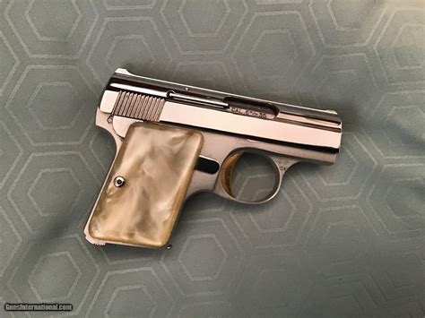Browning Belgium Baby Auto In Rare Bright Nickel With Gold Trigger